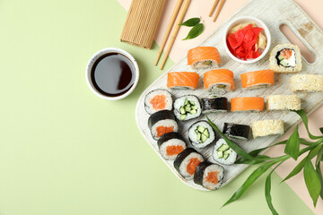 Concept of tasty food with sushi, space for text
