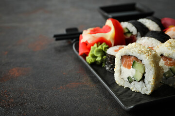 Concept of tasty food with sushi, space for text