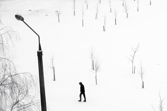 The Figure Of A Man And A Lantern From Above On A Background Of Snow, Belarus