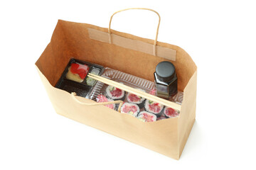 Concept of food delivery with sushi rolls on white background