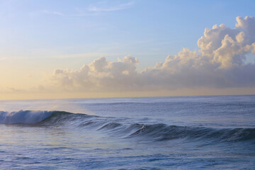 beautiful waves and clouds on the ocean shore 