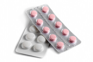 Close-up of a couple white pills or capsules on isolated white background.