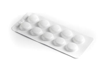 Close-up of a couple white pills or capsules on isolated white background.