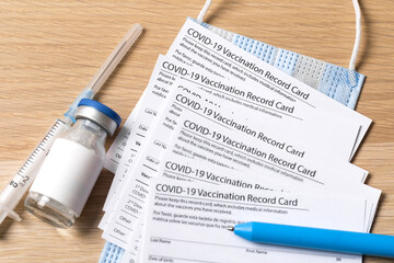 COVID-19 vaccination record card and tourist passport  for worldwide travel during coronavirus pandemic. - Image