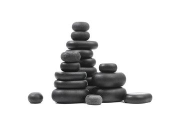 black spa stones isolated on white background .