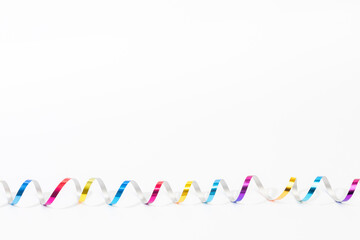 multi color curly confetti isolated on white background.