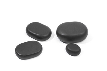black spa stones isolated on white background .