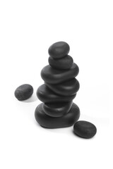 black spa stones isolated on white background .