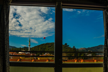MARMARIS, TURKEY: View from the window of the mosque and hotels with apartments in Marmaris.