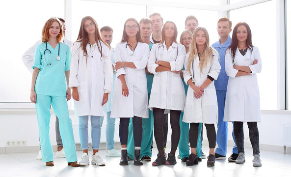 group of experienced doctors standing in the hospital lobby .