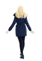 full length portrait of blonde woman wearing long winter coat. and casual clothes. standing pose, isolated on a white studio background.