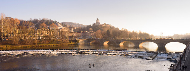 Turin, Italy. February 15, 2022. View on Po River and Vittorio Emanuele I Bridge on the late...