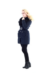 Fototapeta premium full length portrait of blonde woman wearing long winter coat. and casual clothes. standing pose, isolated on a white studio background.