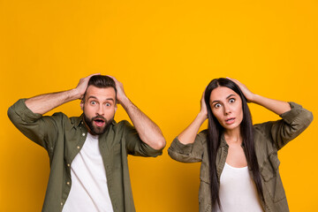 Photo of young husband wife astonished arms touch head fake novelty rumor stupor isolated over...