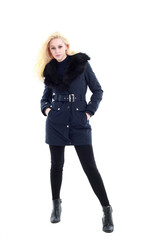 Fototapeta premium full length portrait of blonde woman wearing long winter coat. and casual clothes. standing pose, isolated on a white studio background.