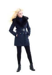 Fototapeta premium full length portrait of blonde woman wearing long winter coat. and casual clothes. standing pose, isolated on a white studio background.