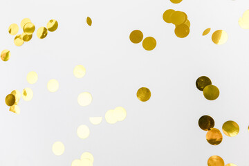 golden confetti on white background flat lay text place .