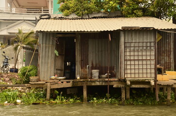 A floating house while sailing the Mekong river delta. Different Vietnam images, streets, markets, rivers.