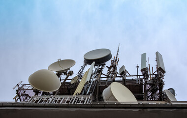 Many antennas transmitters and receivers fot television and mobile phones broadcasting signal