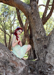fantasy portrait of fairy girl with flowers in red hair and a pretty green dress,  posing in...