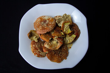 Dried caps of red fly agaric. Treatment with fly agarics