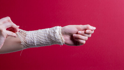 woman's hand bandaged with a medical bandage
