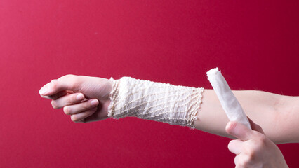 woman's hand holding a medical bandage
