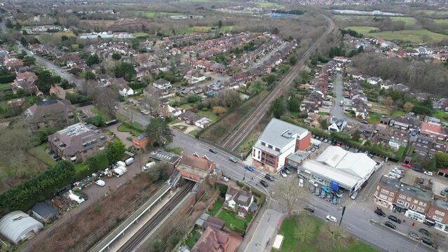 Pull back reveal Chigwell Essex UK drone aerial view High street and residential roads