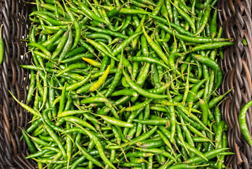 Green chili pepper on the counter of the store. Close-up.
