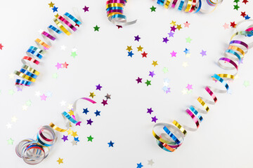 Colorful confetti on white background text place .