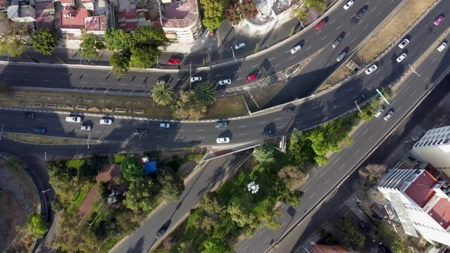 Top Down Rotation Shot of Traffic in Viaducto and Rio Becerra Avenues Junction in Mexico City at Noon
