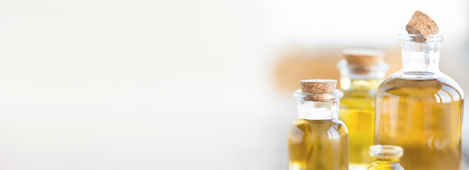 Assortment of organic essential oils. Natural moisturizing body and face treatment. Plant extract for healthy young skin. Relaxation, aromatherapy, salon spa. Close up, copy space