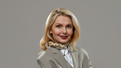 Fototapeta premium Middle aged business woman looking at camera
