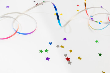 Colorful confetti on white background text place .