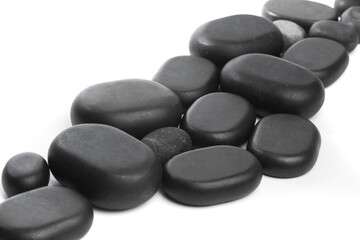black spa stones isolated on white background .