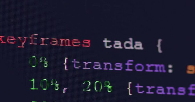 4K Close up shot programming tag code on PC Monitor scroll down. Background concept for programming and coding web development.