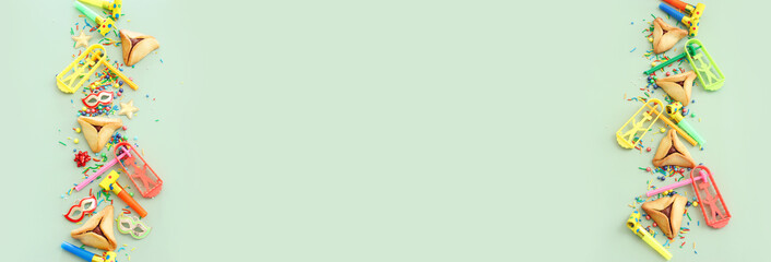 Purim celebration concept (jewish carnival holiday) over green background. Top view, flat lay