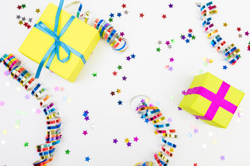 Colorful confetti and presents on white  background text place.