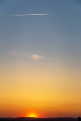 Sunset over the hills in clear weather gorizon