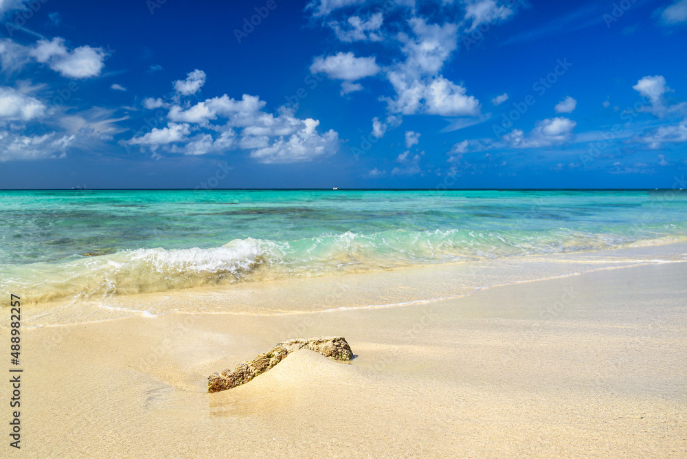 Poster A panoramic view of Arashi Beach on the island of Aruba in the Caribbean with blue skies and white sand