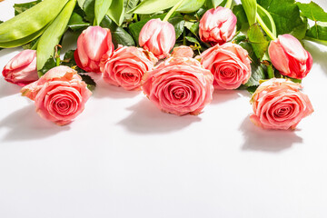 Bouquet of fresh delicate roses and tulips isolated on white background. Romantic gift concept