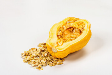 Ripe yellow pumpkin with seeds isolated on white background. Half squash, festive decorative element
