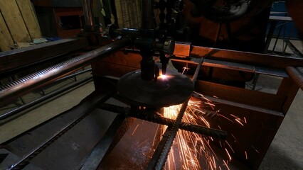 Gas cutting machine for metal carving at the factory. The master works with a machine for cutting blanks