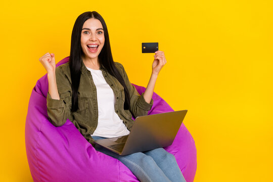 Photo of hooray millennial lady show laptop card yell wear shirt jeans isolated on yellow background