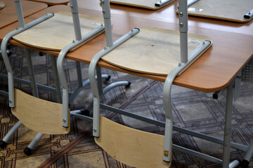 Chairs and desks in the school classroom
