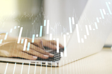 Multi exposure of abstract financial diagram with hand typing on computer keyboard on background, banking and accounting concept