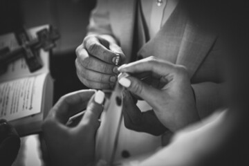 Holding wedding rings. Noble metal jewellery for married couples.Wedding ceremony and...