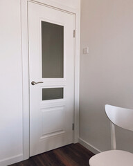 White door in the interior with white walls new apartment