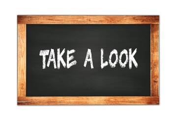 Fototapeta premium TAKE A LOOK text written on wooden frame school blackboard.