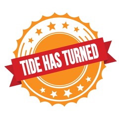 TIDE HAS TURNED text on red orange ribbon stamp.